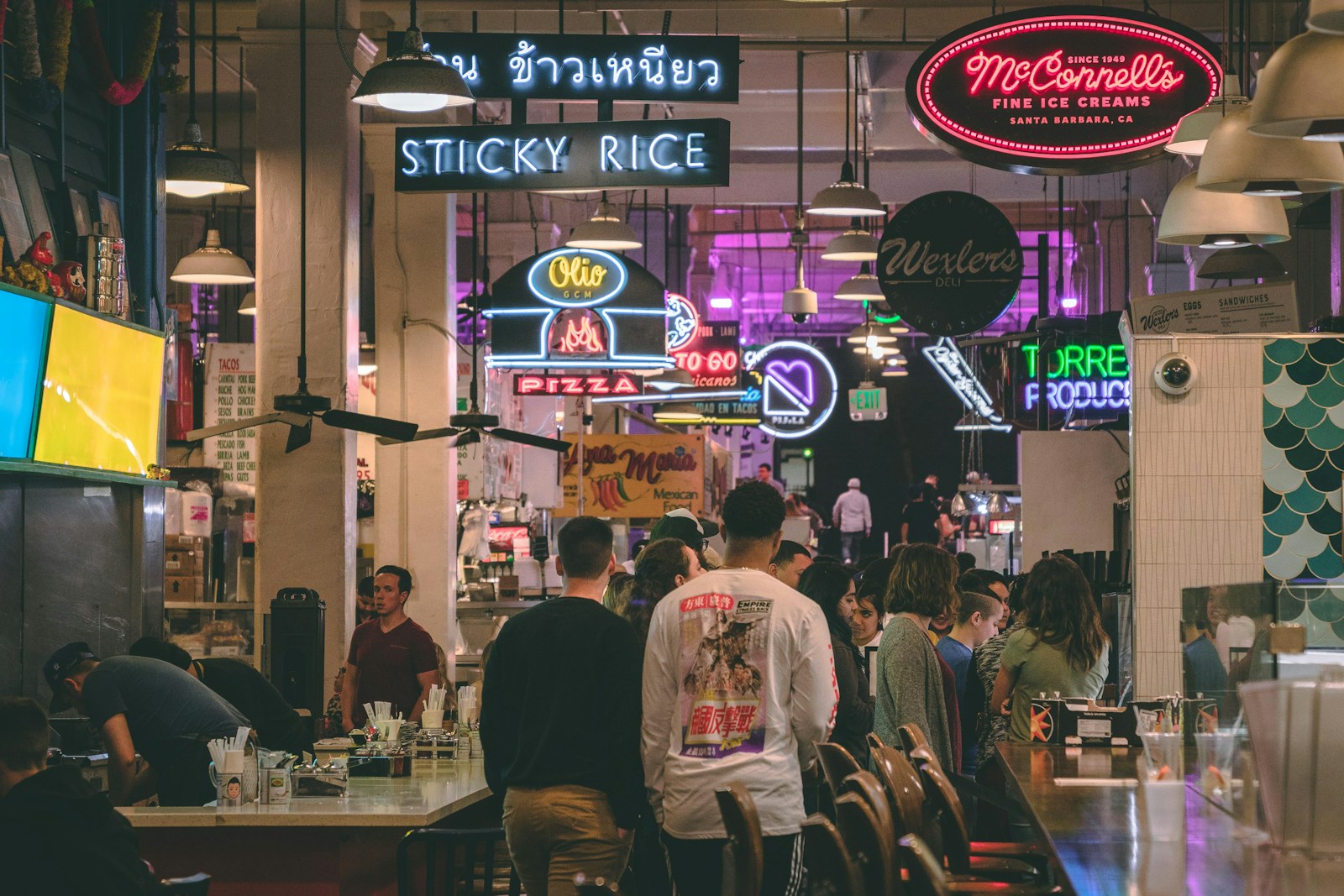 people walking beside table
